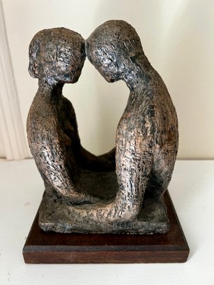 Sculpture Of A Man And Woman Couple In Love