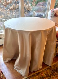 Custom Round Gold Table Cloth Over Oak Pedestal Table