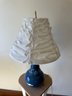 Blue Glass Lamp With Floral Decor And Cinched Shade