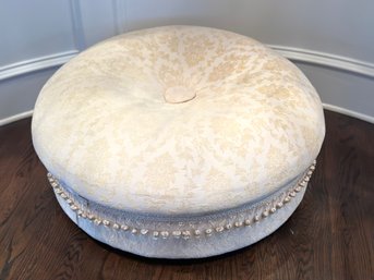 Round Cream Colored Ottoman With Tassles