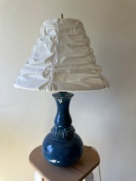 Blue Glass Lamp With Floral Decor And Cinched Shade