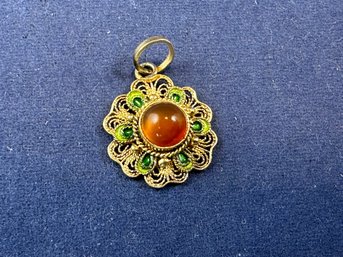 Sterling Silver Small Pendant With Green Enamel Accents And Amber Colored Cabochon