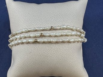 Triple Strand Freshwater Pearl And 14K Yellow Gold Bracelet, 7.5'