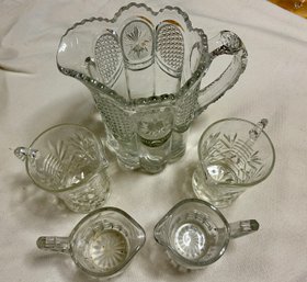 Collection Of Large And Small Crystal Pitchers