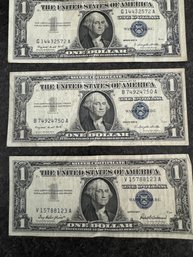 (3) 1957, 1957 A $1 Silver Certificates