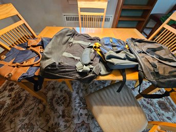 Collection Of Backpacks And Overnight Bags