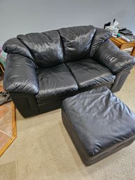 Two Cushion Black Leather Sofa And Ottoman