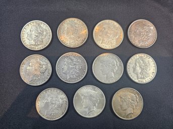 Lot Of Eleven Silver Dollars