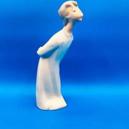 Lladro Porcelain Figurine  A Little Boy Leaning Over For A Big Kiss