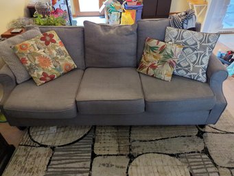Gray Fabric Couch With Decorative Pillows Included - Inside Of Couch Is On Rough Shape
