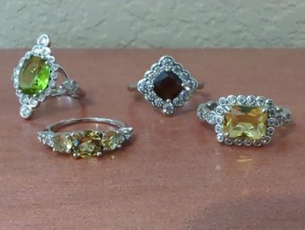 4 Pc Collection Of  'Ring Bomb' Rings With Lab Created Stones  And Rhodium Bands Various Sizes
