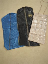 Two Vintage Vinyl Garment Bags And One Hanging Vinyl Pocket Jewelry Keeper