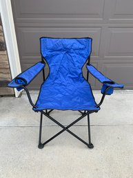Blue Outdoor Folding Arm Chair Has Areas Of Wear