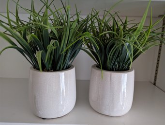 Two White Porcelain Planters With Faux Plants - Approximately 8 In High