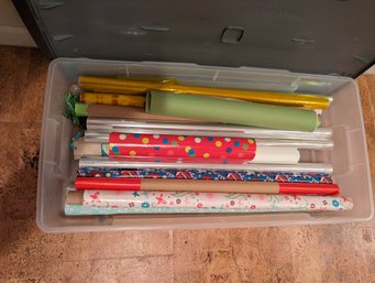 Plastic Bin Of Various Wrapping Paper And Clear Plastic Foil Wrap - Bin Included