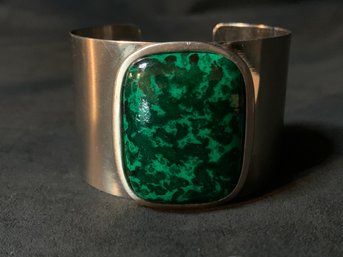 Silver Tone Cuff Bracelet With Green Accent