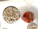 9 Gorgeous  Art Glass Assorted Paper Weights In Red & Clear
