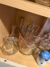 K/ 3 Shelves Of Asstorted Salt & Pepper Shakers, Mugs, Cruets, Measuring Cups & More