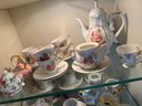K/ 3 Shelves 32 Pcs Asstd Teapots & Tea Cups - 1 Music Box, Aynsley, Bethany Staffordshire, Colclough, Japan..