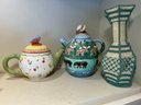 K/ Shelf W 8 Teapots (1 A Music Box), 2 Vases, Cream & Sugar, Glass Swan - Lefton, Nantucket, Whittard..