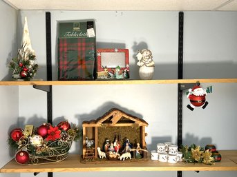 C/ 2shelves - Assorted Christmas Decor Lot: Manger, Ceramic And Wood Napkin Holders, Table Cloth Etc