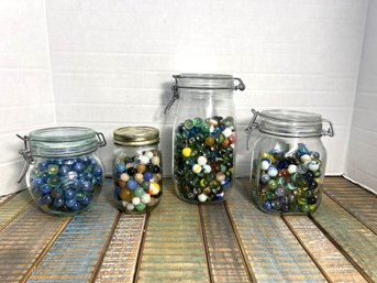 CRQ8/RER 4pcs: 4 Jars Of Beautiful Colored Marbles