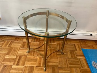 Round Glass Top Accent Table With Brass Colored Base And Interesting Feet