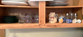 K/ Shelf Of Green Glass 6' Plates,  Asstd Salt & Pepper, Purple Painted Low Glasses, Puss N Boots Creamer Etc