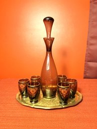 DR/ Gold And Amethyst Colored Decanter & 6 Small Cups On Etched Brass Tray