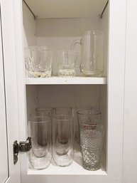 K/ 2 Shelves With 13 Pieces Of Glassware: 9 Tall Glasses, 1 Mug, 3 Short