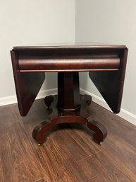 AD/ Beautiful Vintage Empire Drop Leaf Table On Metal Casters