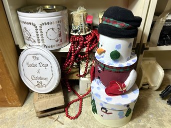 B/ 2shelf - Assorted Christmas Decor: Large Tins, Ornaments, Garland, Candles Etc