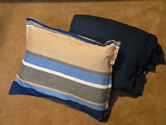 Navy Blanket And Stripped Pillow