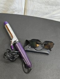 Curling Iron And Sunglasses