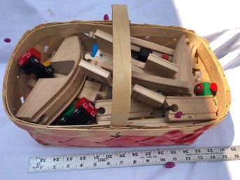 Basket Of Wood, Brio Train Track, And Trains