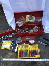 Red Metal Toolbox With Various Tools And Supplies. Dirty And Untested.