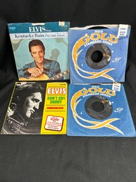 Elvis 45 RPM Records With Original Sleeves.