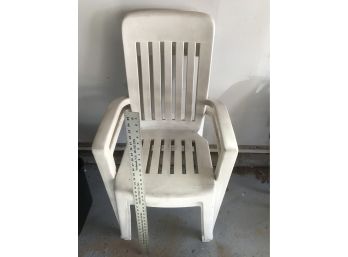 2 White Plastic Chairs