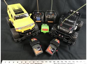 Two New Bright Remote Radio Control Trucks. Comes With Three Rechargeable Batteries. Tested Works Great