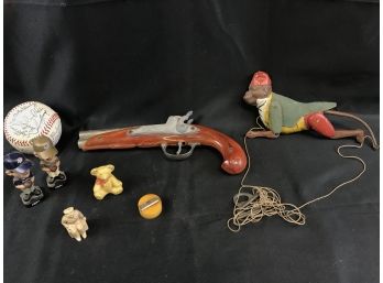 Assortment Of Toy Items,Gun, Mini Bobble Heads, Facsimile Signed Baseball, Tin Monkey