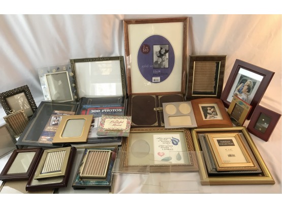 Lot Of Picture Frames And Photo Albums
