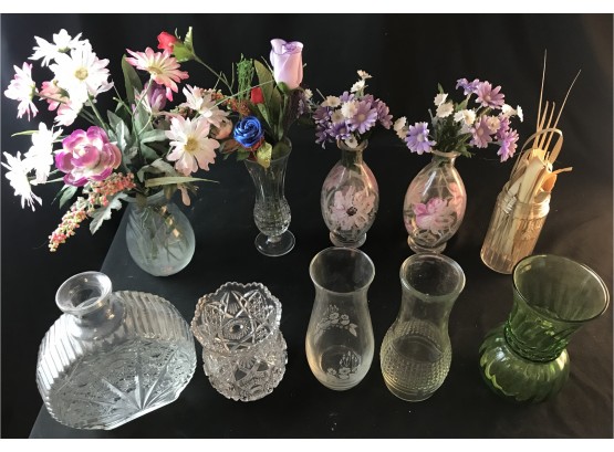 Assorted Glass Vases And Some Flowers