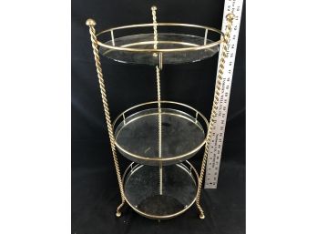 3 Tier Metal Stand With Mirror Shelves. Aprox 26” High And 12 Diameters