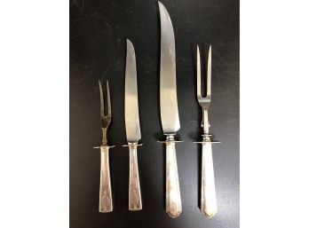 2 Carving Sets/ One Sterling Handles/ One Electroplated Silver.