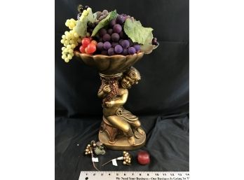 Statue Holding Large Amount Of Grapes And Fruit