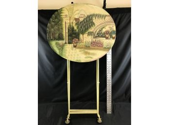 Folding Metal Oval Table With Lovely Garden Scene, 25 X 21 And 30 Inches High