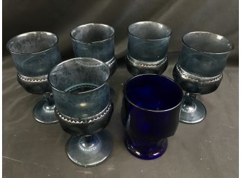 8 Light Blue Heavy Cut Glass Goblets And One Dark Blue Drinking Glass