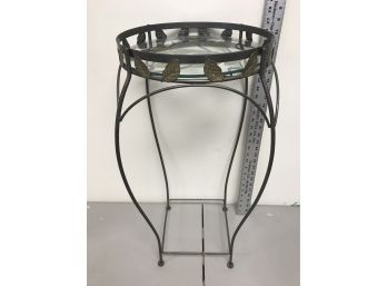Metal Table Or Stand With Leaf Motif And Glass Top, 27 Inches Tall And 12 Inches In Diameter