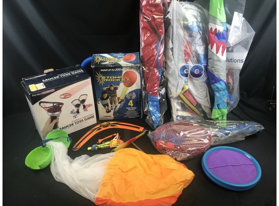Lot Of Childrens Items, Bag Of Kites,  Ball Parachute, Boomerang, Rocket, Toss Game, Badminton
