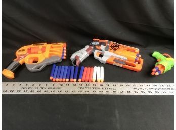 Two  Nerf Doom Lands Persuader, Nerf Hammer ShotAnd One Small Target Green Gun. Tested